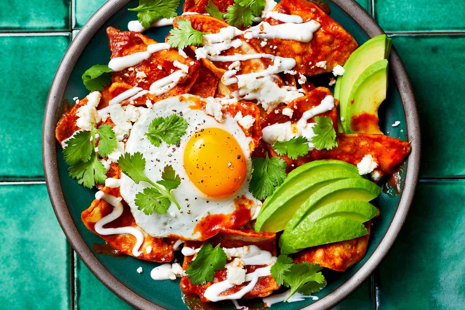 Chilaquiles Rojos with Fried Eggs and Cotija
